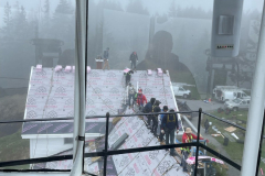 Crew Passing Roof Shingles Up